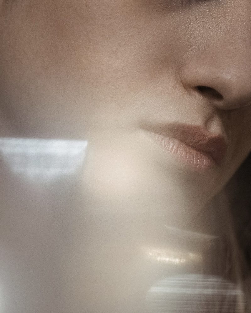 Soft light across a jaw and neck